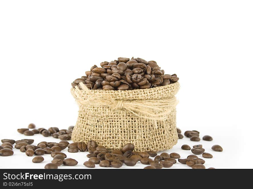 Coffee beans in a bag. Isolated on white background