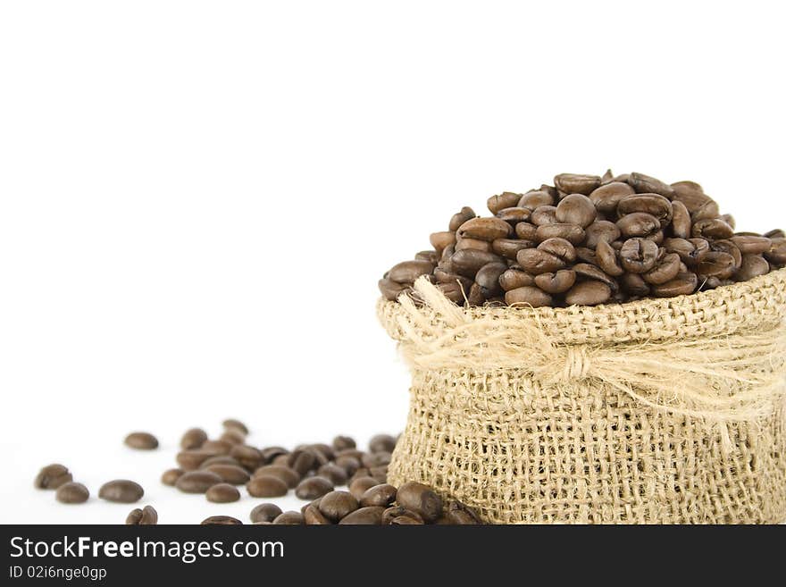 Coffee beans in a bag. Isolated on white background