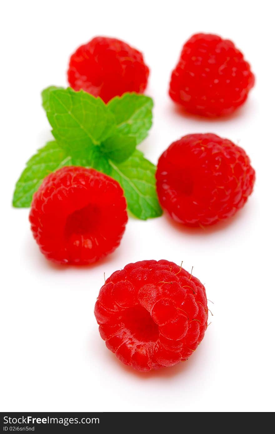 Raspberries And Green Leaf Isolated