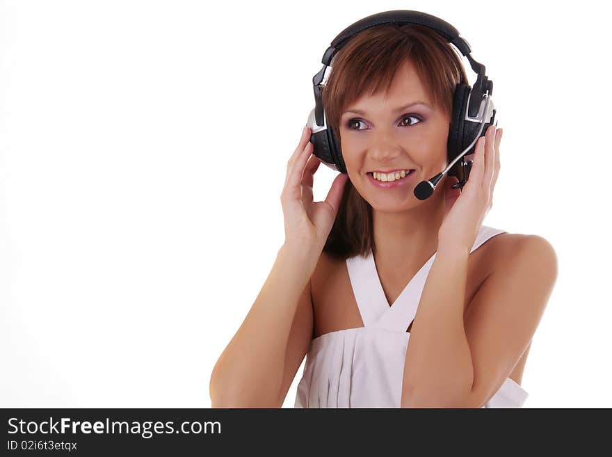 Portrait of a beautiful woman posing in headphones and white dress isolated on a white background