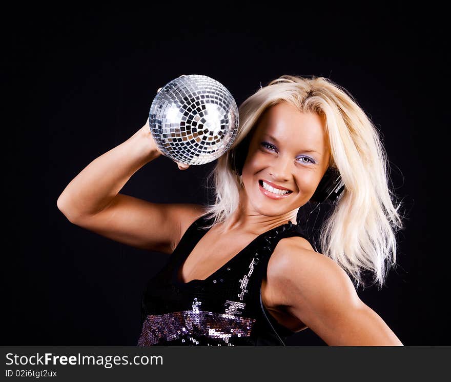 blonde is holding a sphere. blonde is holding a sphere