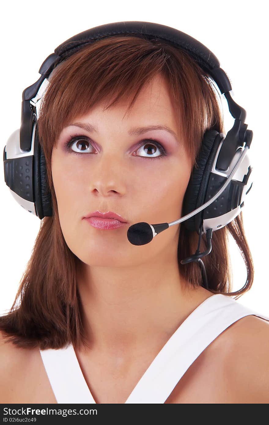 Close up Portrait of a beautiful woman posing in headphones and white dress isolated on a white background