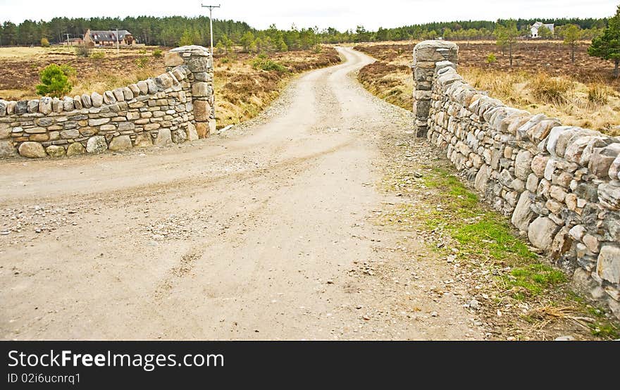 Stone wall entrance to house on the hill.