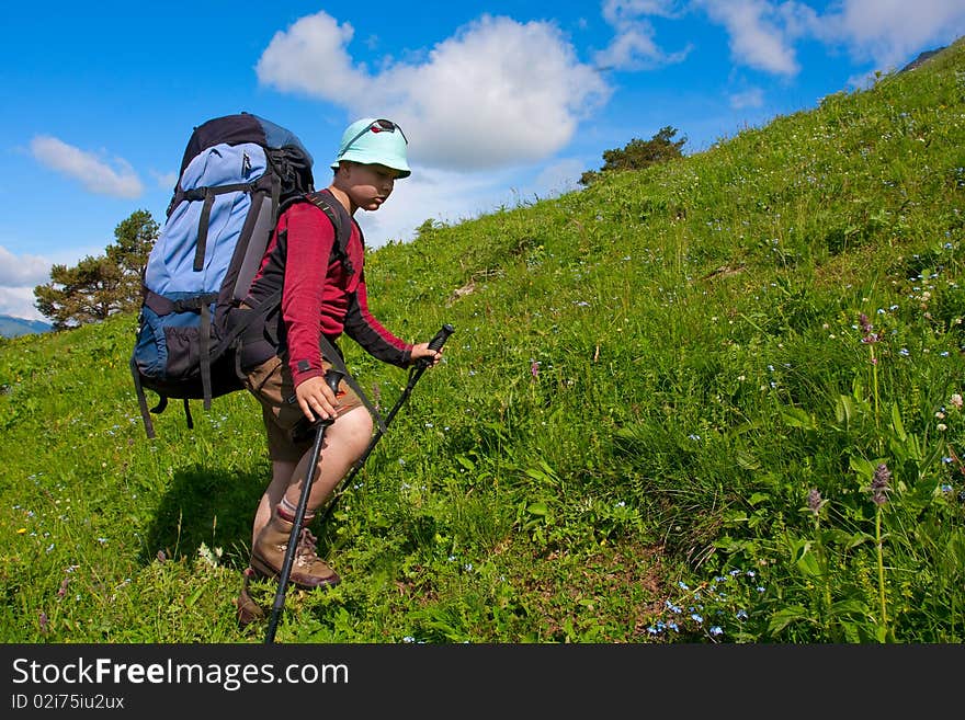 Hiker boy in Caucasus mountains