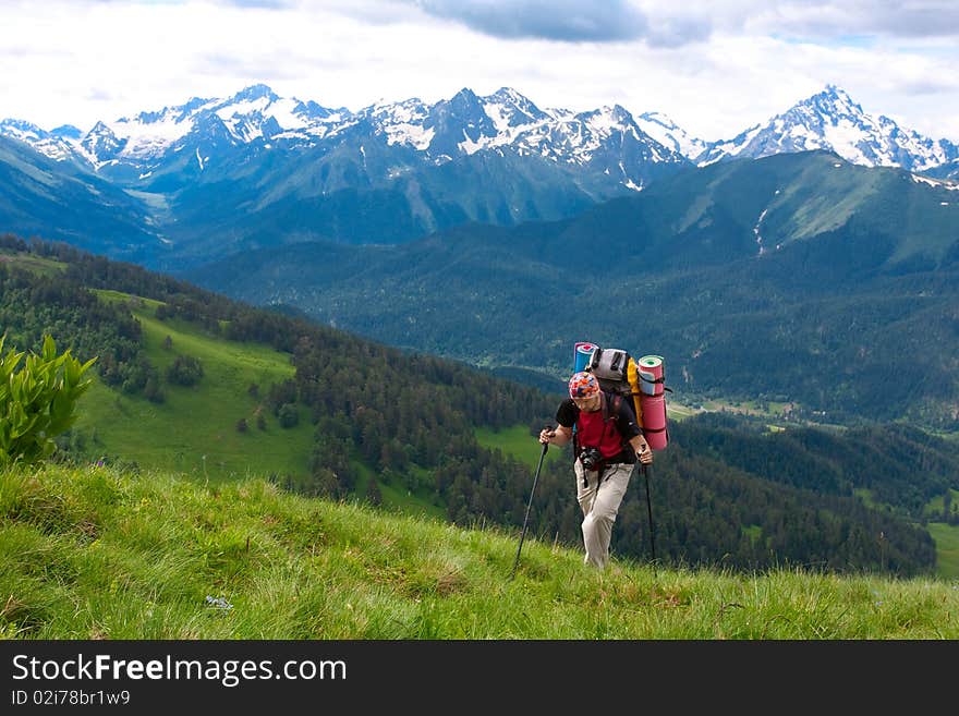 Hiker boy in Caucasus mountains