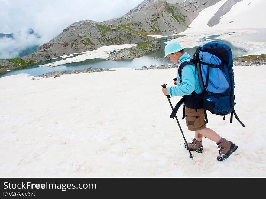 Hiker boy in Caucasus mountains