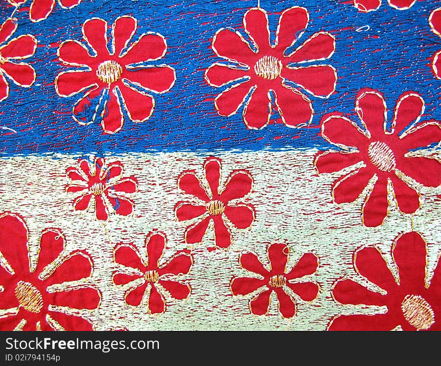 Indian hand embroidery fabric with silk thread on cotton material.