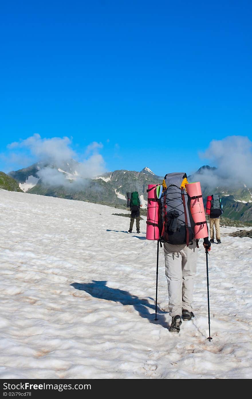 Hiker boy in Caucasus mountains