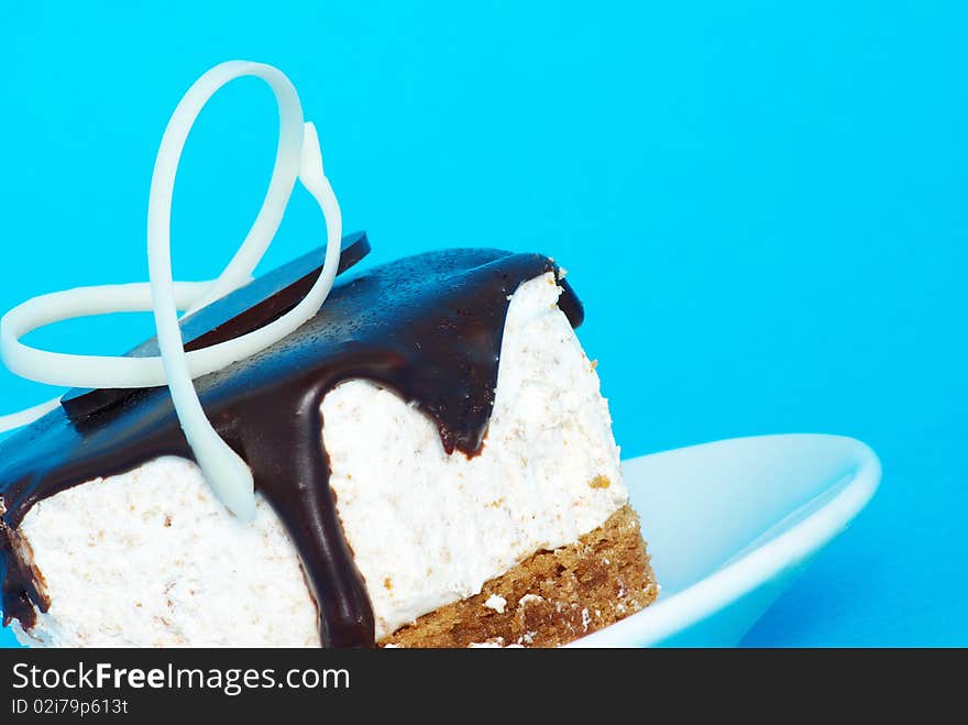 Fresh cake isolated on a blue background