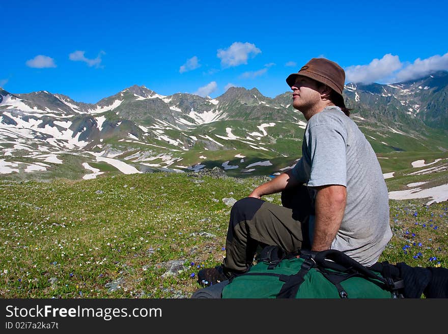 Hiker boy in Caucasus mountains