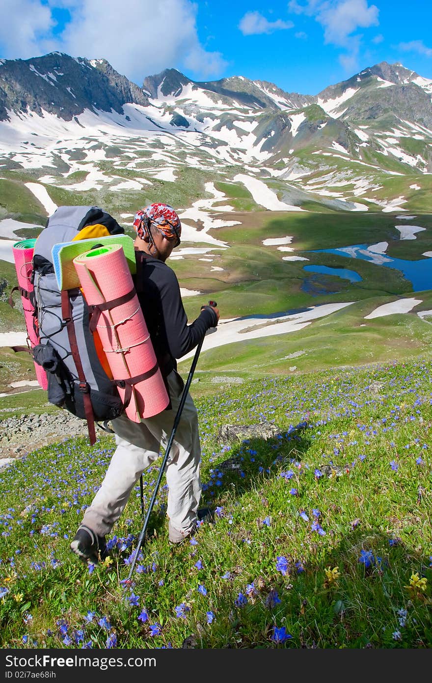 Hiker boy in Caucasus mountains