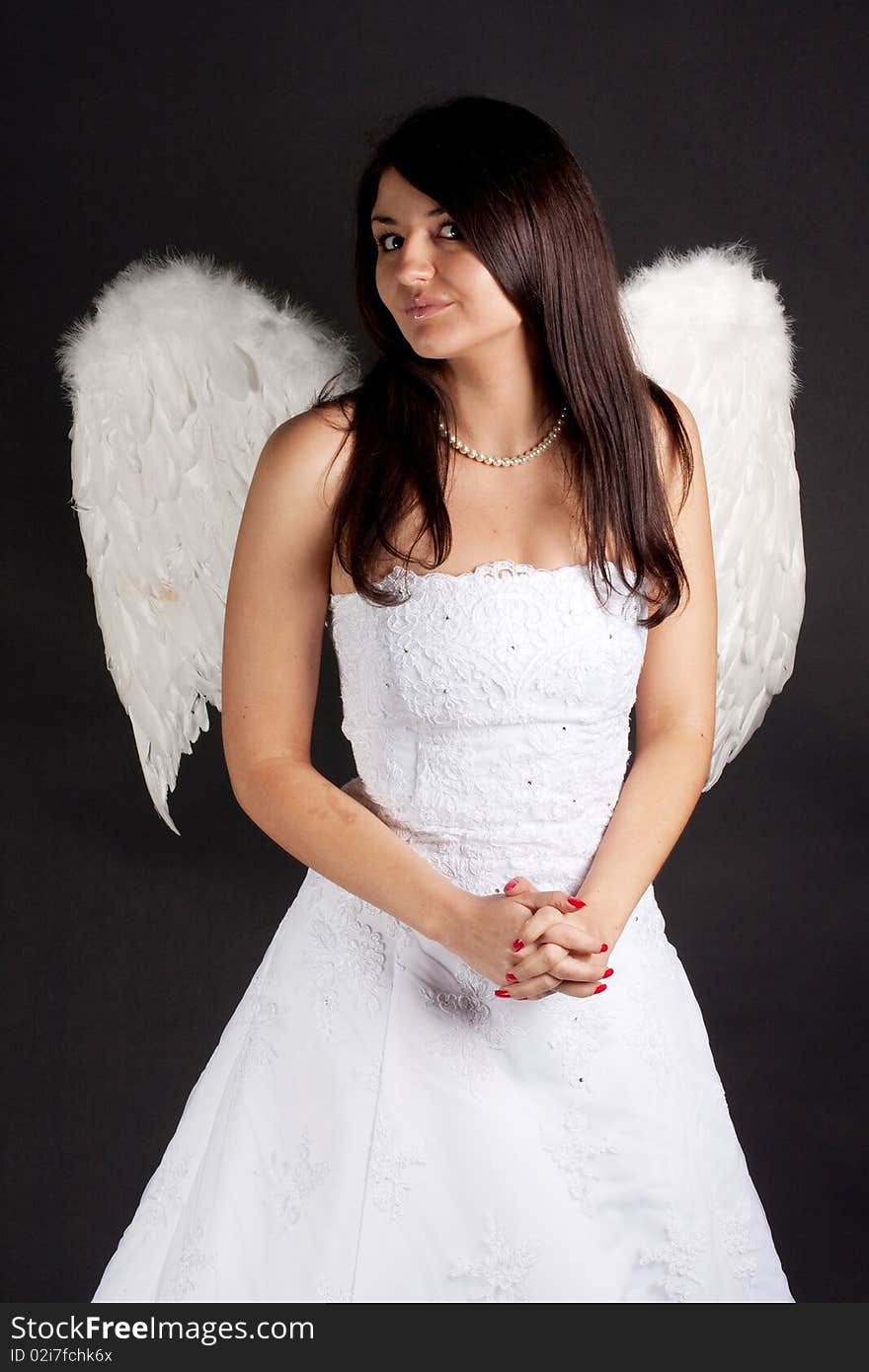 Angel with white wings on a black background