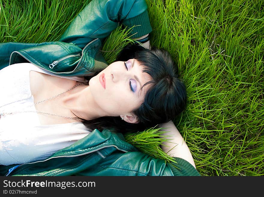 Young model laying in the grass (soft). Young model laying in the grass (soft)