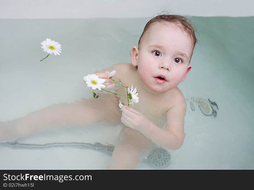 Baby is taking the bath. Baby is taking the bath