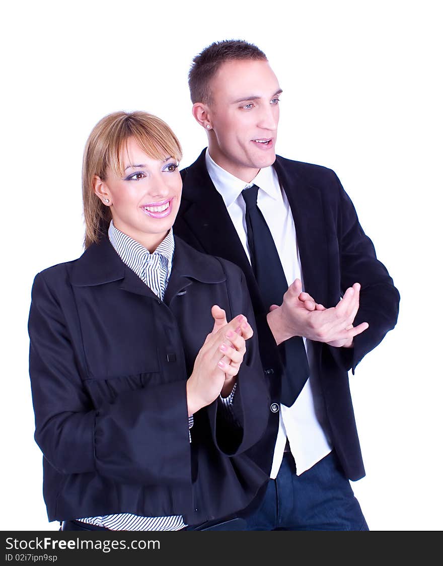 Young business woman and business man clapping hands. Studio shot