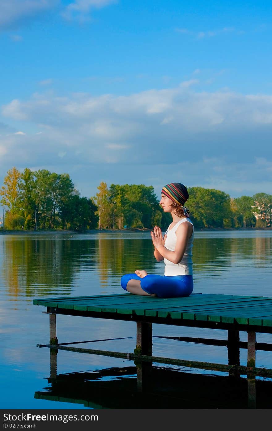 Female doing yogatic exericise in nature