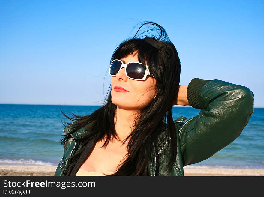 Woman sun bathing on the beach