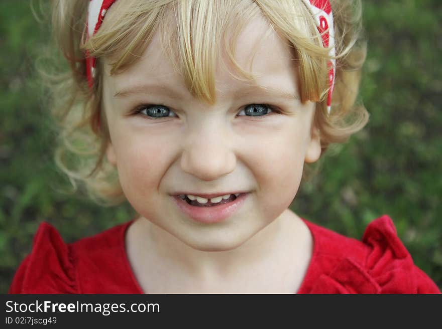 Portrait of a little blue-eyed girl on walk