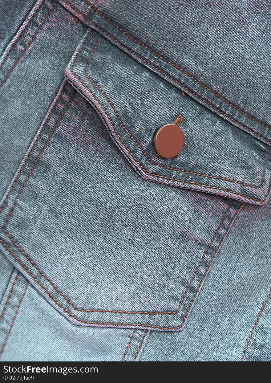 Closeup of gray denim jeans pocket