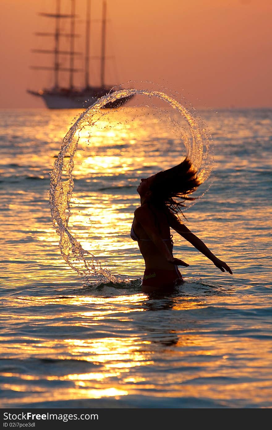 Girl with long hair playing in the sea. Girl with long hair playing in the sea