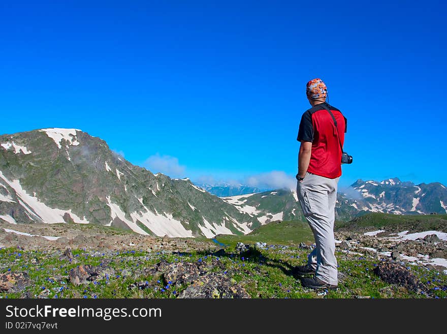 Hiker boy in Caucasus mountains