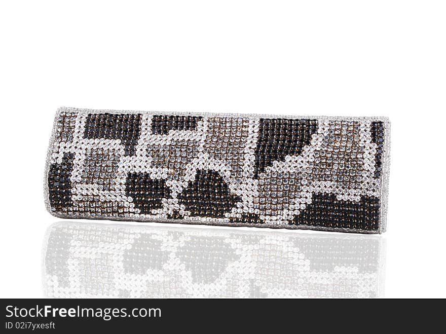 This is a beautiful ladies fancy clutch purse isolated on a white background.