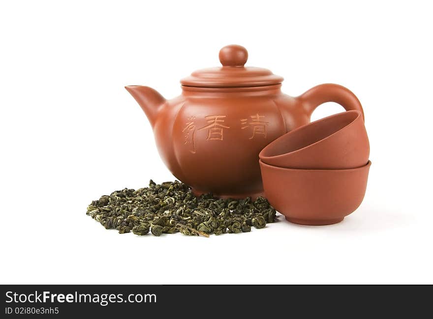 Chinese teapot and two cups on a white background