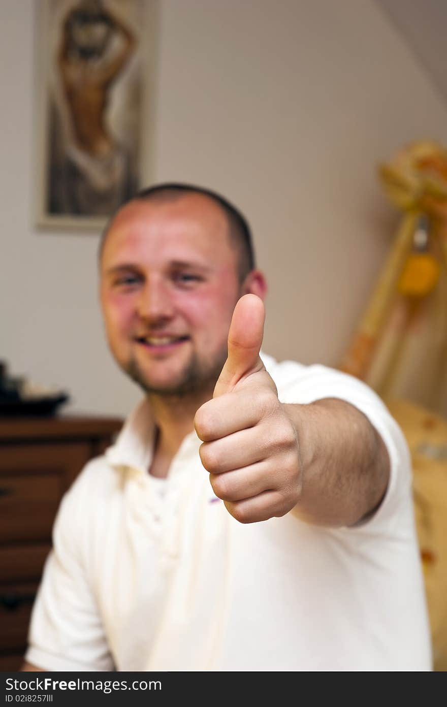 Man with thumbs up,selective focus on the thumb