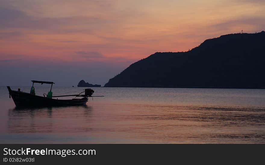 An empty boat is waiting to be occupied by the fisherman in the very morning, Thailand. An empty boat is waiting to be occupied by the fisherman in the very morning, Thailand.