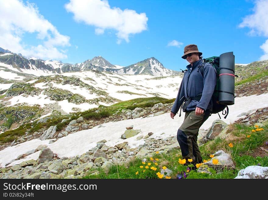 Hiker boy in Caucasus mountains