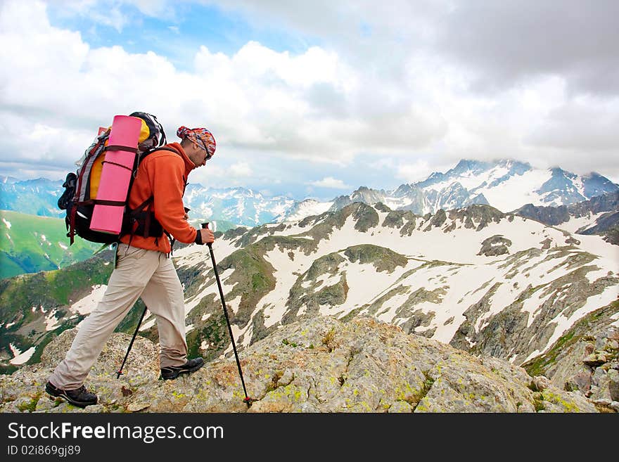 Hiker boy in Caucasus mountains