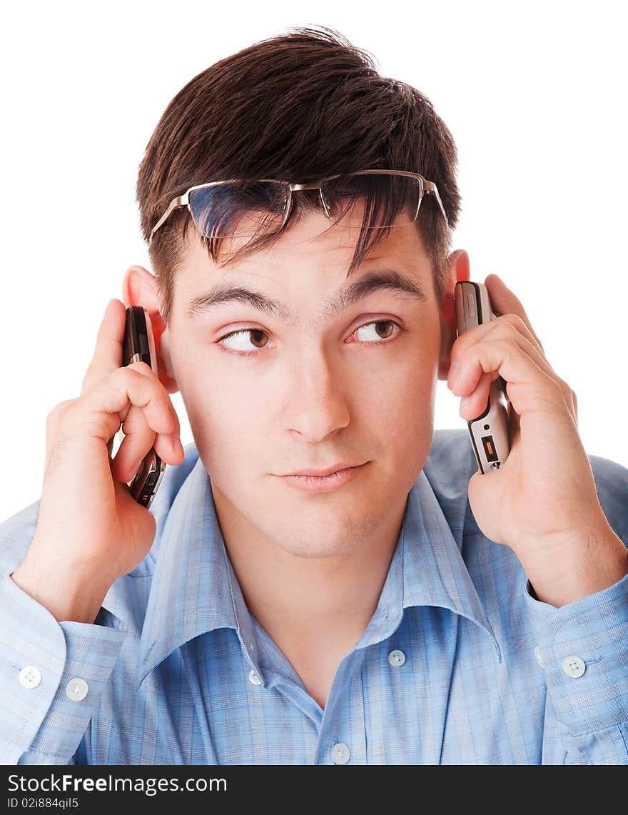 Young man holding two cell phones. Young man holding two cell phones