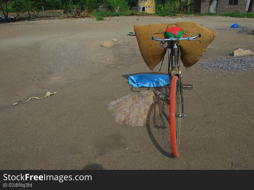 Old bicycle loaded with bag