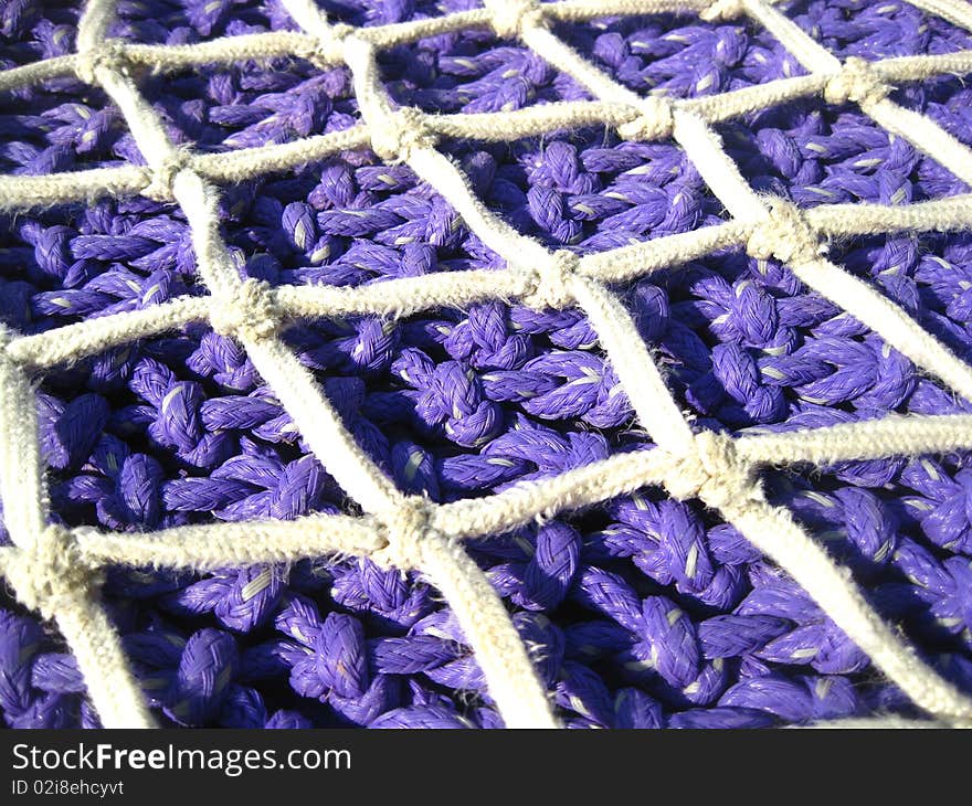 Blue Fishing net on a harbpur in Spain