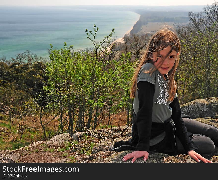 Portrait of pretty teenager on the hill