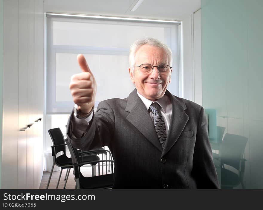 Senior businessman with thumbs up. Senior businessman with thumbs up