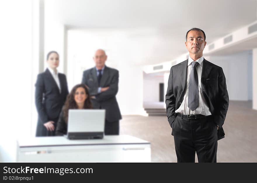 Japanese businessman with group of business people on the background. Japanese businessman with group of business people on the background