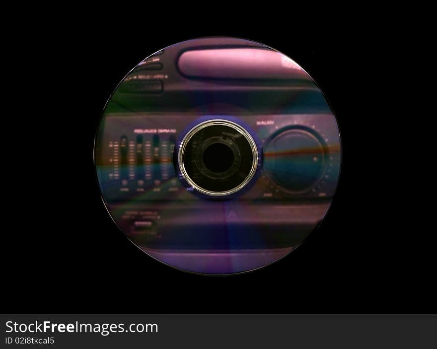 The reflection of a music player the dvd on a disk. The reflection of a music player the dvd on a disk