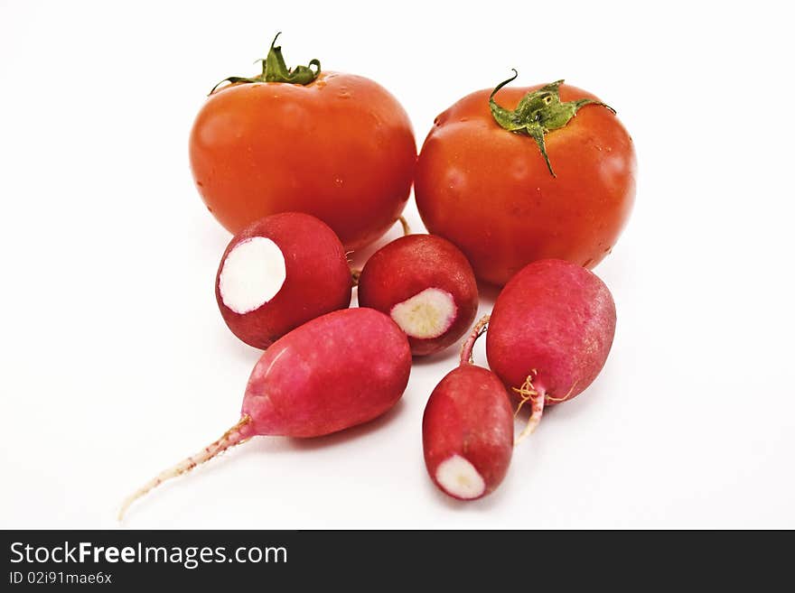 Tomatoes and radishes on white background, vegetables. Tomatoes and radishes on white background, vegetables