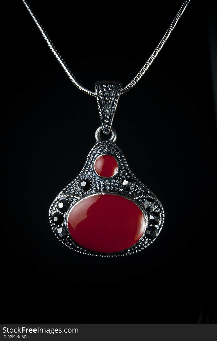 A pendent on a black background. A pendent on a black background