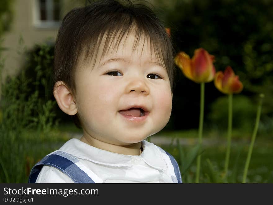 Cute little girl at beautiful garden