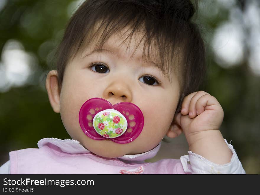 Cute innocent girl in garden