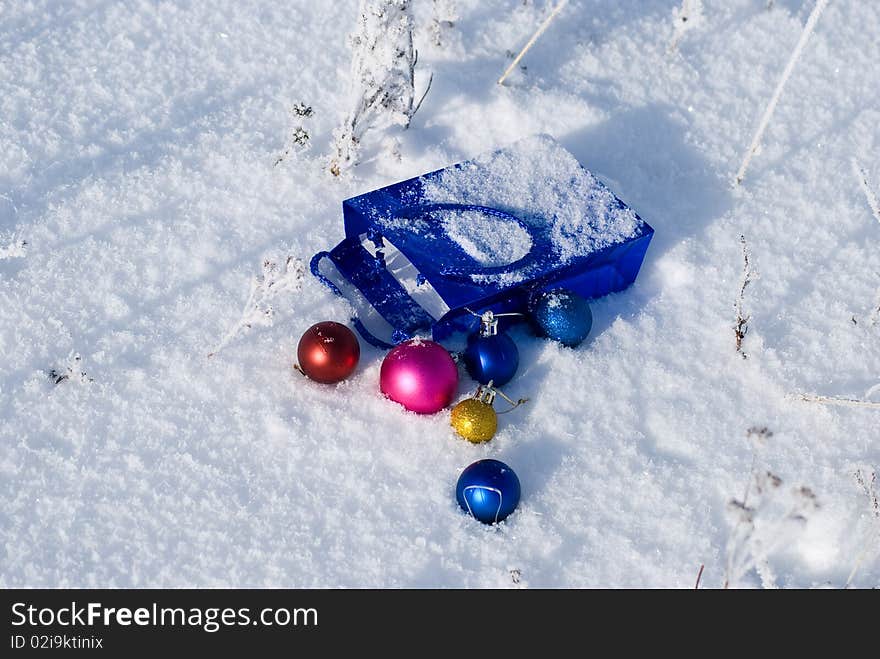 Christmas balls on fresh snow