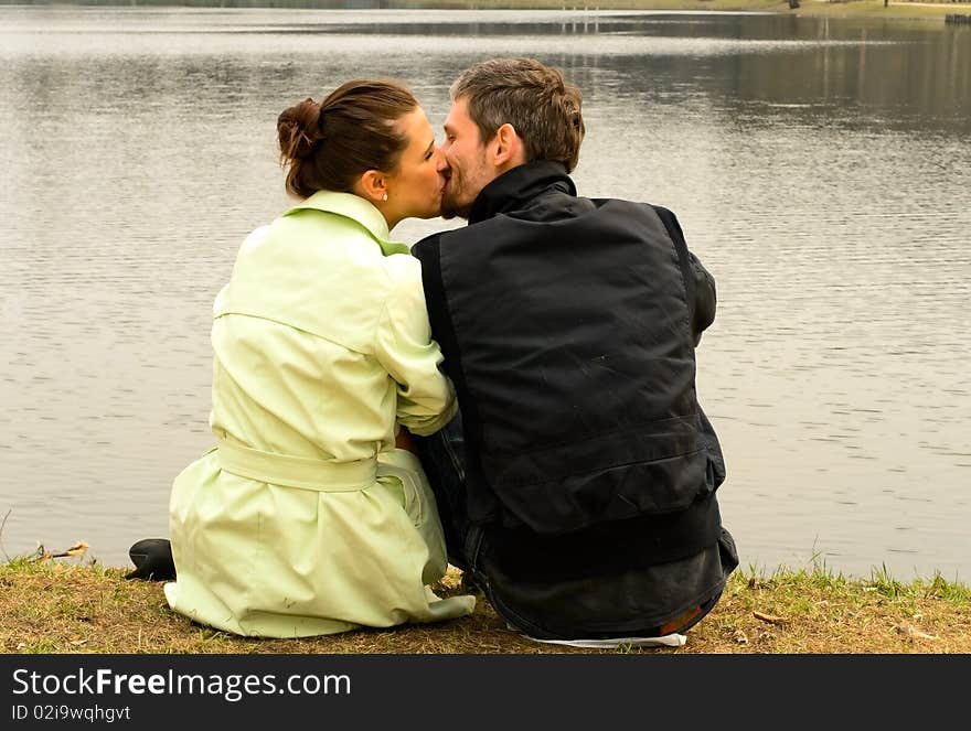 Young loving couple near the lake. Young loving couple near the lake