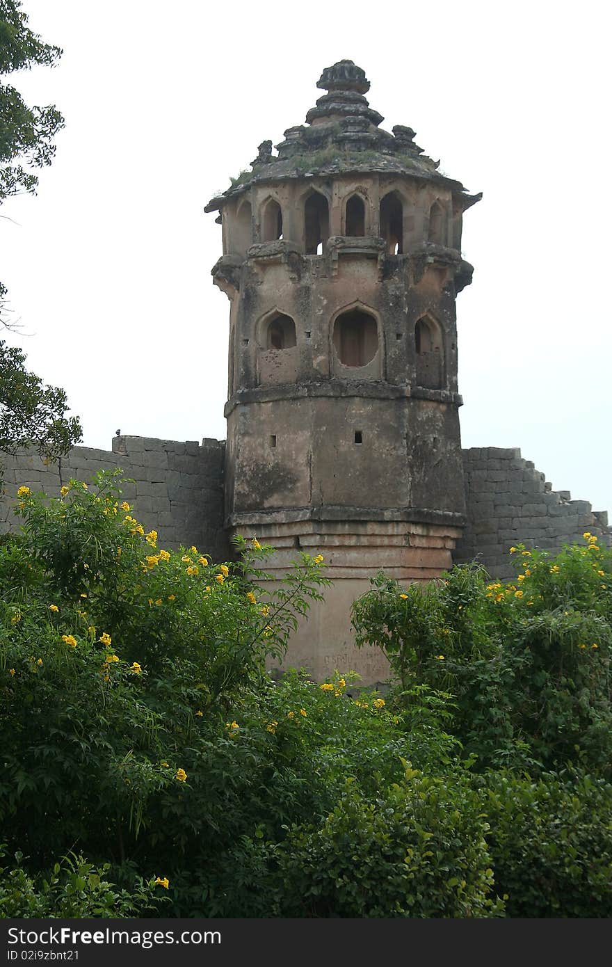 Historical, artistically designed watch tower in the corner of compound of Lotus Mahal at Hampi, Karnataka, India, Asia. Historical, artistically designed watch tower in the corner of compound of Lotus Mahal at Hampi, Karnataka, India, Asia