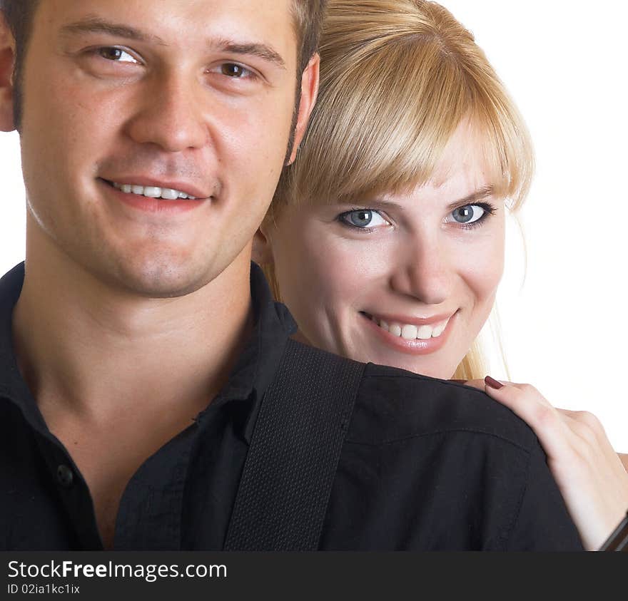 Happy young pair pose on a white background. Happy young pair pose on a white background