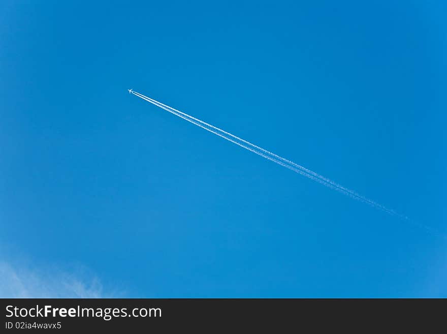 Beautiful blue sky with condension trail of an aircraft