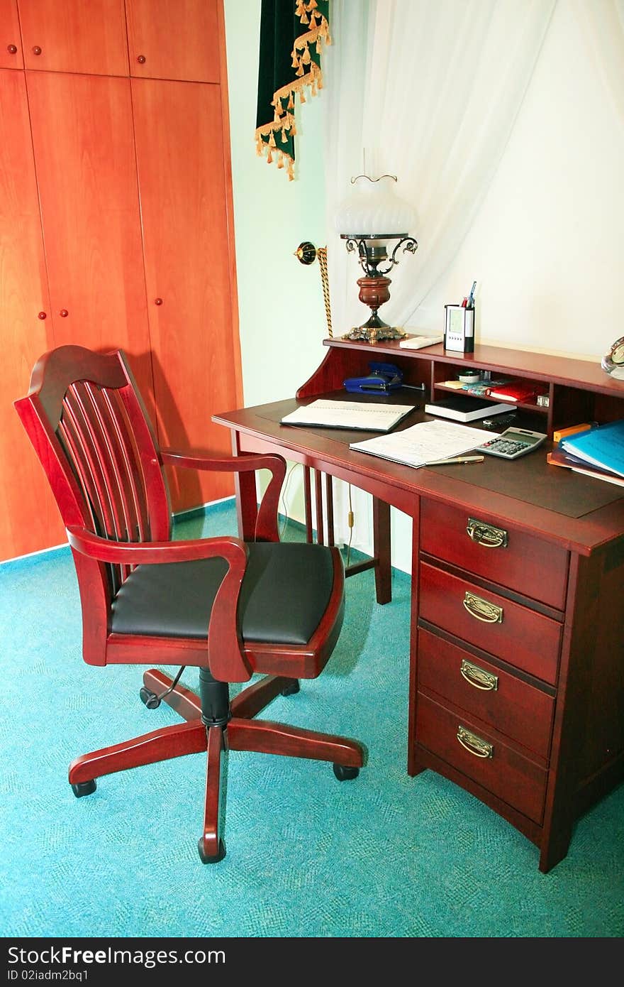 Office furniture, wooden arm-chair and table.