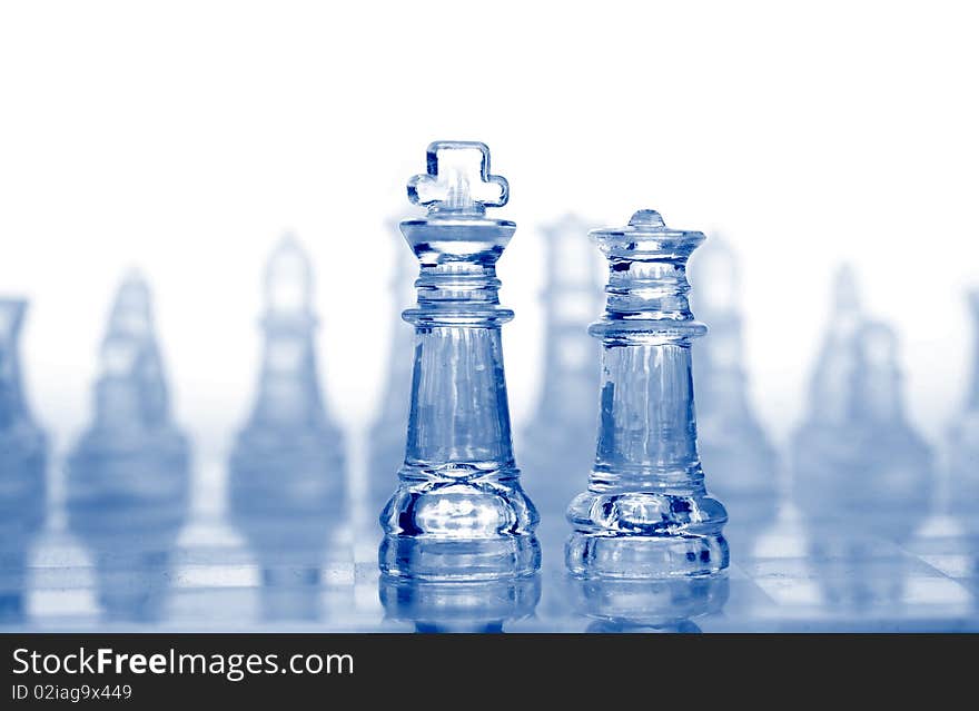 Glass chess pieces with blue light