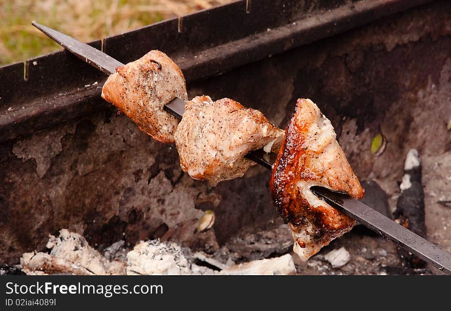 Close up view on BBQ preparation outdoors. Close up view on BBQ preparation outdoors